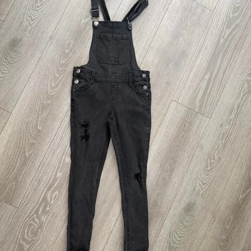 Black denim overalls with distressed